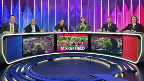 A shot of the five panellists on the BBC Question Time - Greater Manchester Mayor Andy Burnham, Michael Winstanley of the Conservative Party, Liberal Democrat Jake Austin, Sarah Wakefield of the Green Party and Robert Kenyon of Reform UK