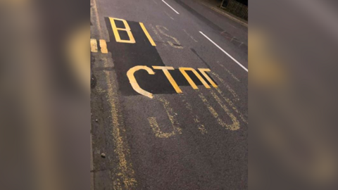 The bus stop marking was only partially repainted