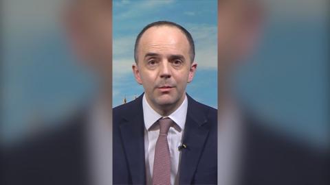 Health Secretary James Murray wearing suit and tie