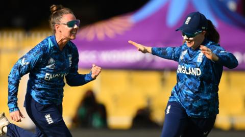 England celebrate a wicket