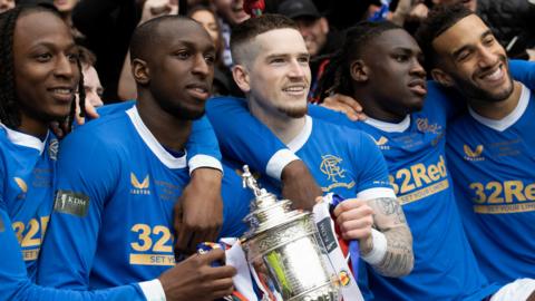 Rangers players celebrate with the Scottish Cup