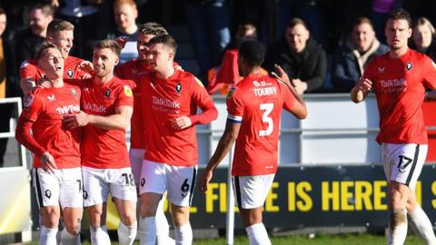 Salford celebrate going ahead against Northampton