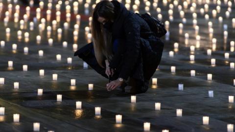 Activists lit almost 5000 candles to commemorate the people who died with coronavirus in Switzerland, on the Bundesplatz, front of the Federal Palace, in Bern, Switzerland, 06 December 2020