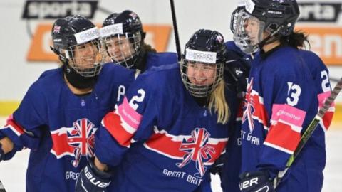 Great Britain women's team celebrate scoring against Poland at the Women's World Championship Division 1 Group B tournament in Riga