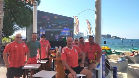 Hywel Price and other fans at a bar in Dubai