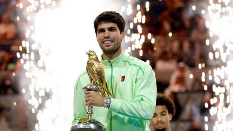 Carlos Alcaraz celebrates winning the Qatar Open
