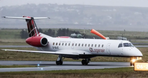 A small plane taking off in cloudy conditions