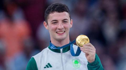 Rhys McClenaghan with his Olympic gold medal