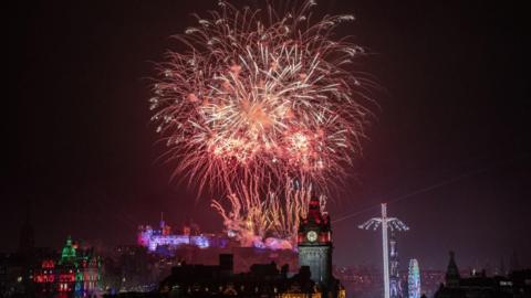 Fireworks in Edinburgh Castle. They are big and red.