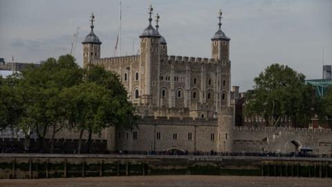 A view of the historic castle, which is located on the bank of the River Thames in central London, from a boat.