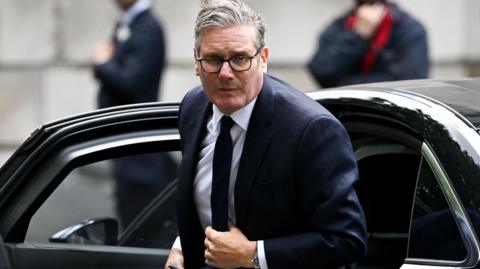 Starmer getting out of a car