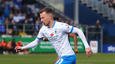 Elliot Newby playing for Barrow