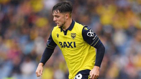 Tyler Goodrham of Oxford United in action for his side as he dribbles with the ball