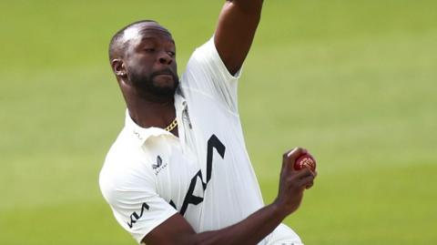 Kemar Roach bowling for Surrey