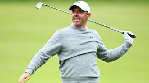 Rory McIlroy reacts after an iron shot