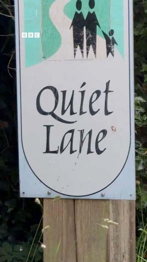 A sign saying Quiet Lane