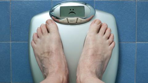 Man checking his weight
