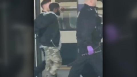 Still from video of a man being arrested at Dartford station