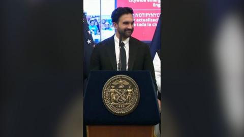 Zohran Mamdani, Mayor of New York City behind a podium