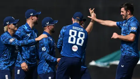 England celebrate a wicket
