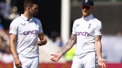 England's Mark Wood and Ben Stokes talk during day two of the second Test against West Indies at Trent Bridge