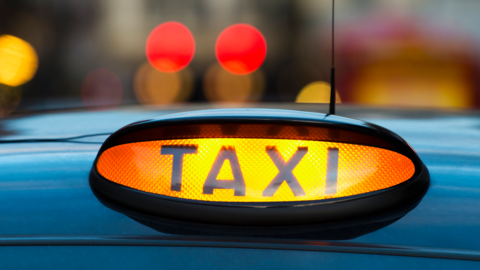 Taxi with sign