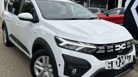 An example of a white Dacia SUV