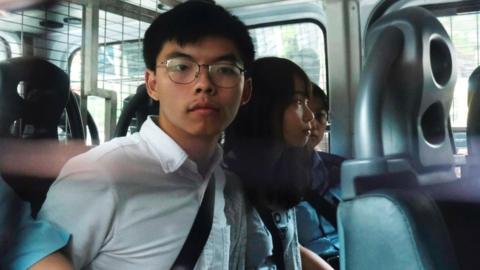 Joshua Wong and Agnes Chow arrive at court