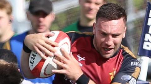 Billy McBryde of RGC is tackled