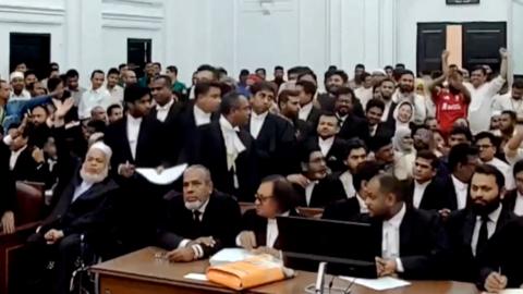 People in court, including lawyers and prosecutors, as verdict announced