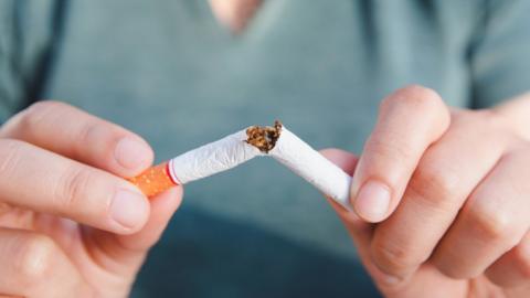 A cigarette being snapped