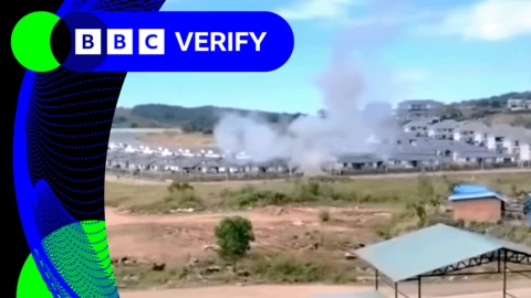 Smoke rising over buildings