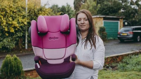 Kayleigh Powell, pictured with one of her child car seats