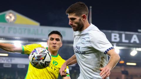 Ched Evans (right) in action for Preston North End against Norwich City at Carrow Road