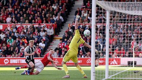 Lewis Hall unsuccessfully attempting to stop Elliot Anderson scoring for Nottingham Forest against Newcastle