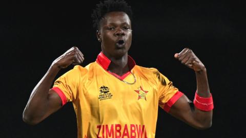 Blessing Muzarabani celebrates a wicket for Zimbabwe