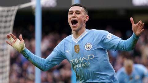 Manchester City's Phil Foden celebrates scoring against Manchester United