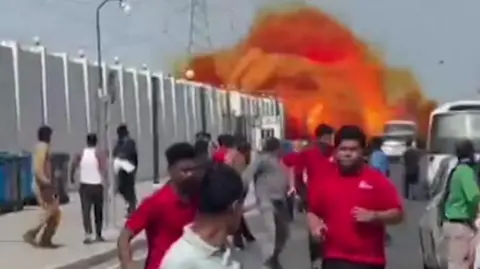 People running from fireball in Doha street