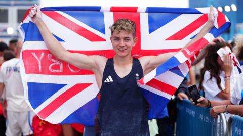 Great Britain's Toby Roberts celebrates winning gold in the Men's Boulder & Lead, Final at Le Bourget Climbing Venue on the fourteenth day of the 2024 Paris Olympic Games in France.