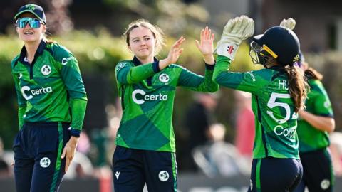 Ireland's Lara McBride (centre) is congratulated after taking a wicket in the third T20 international against Pakistan