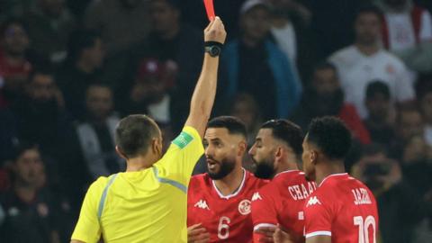 Tunisia defender Dylan Bronn is sent off in a friendly game against Brazil