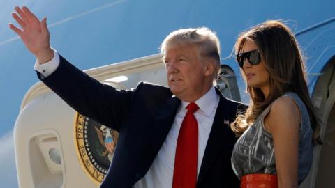 US President Donald Trump and first lady Melania Trump board Air Force One as they depart Hamburg, Germany, for Washington, 8 July 2017