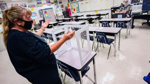 A Florida teacher prepares her classroom for the school year