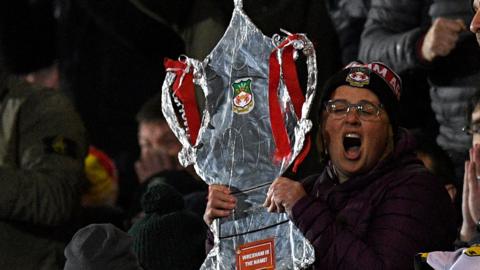 Wrexham United supporter holds tin foil FA Cup