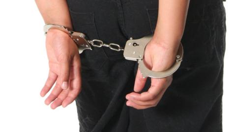 Female child in handcuffs