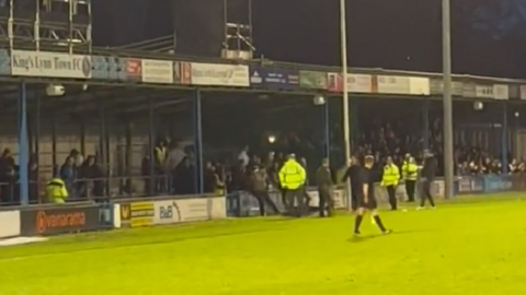 Fans appearing to fight at the King's Lynn Town FC vs Boston United match