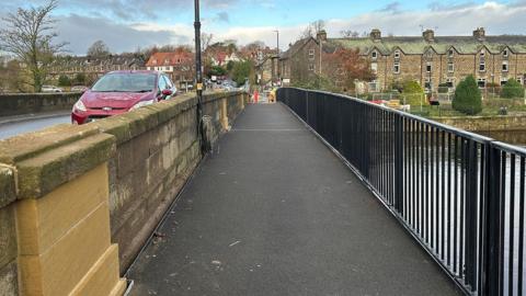 A freshly concreted footbridge.