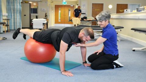 A man receiving physio at the treatment centre