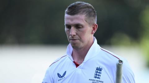 Zak Crawley walks off after being dismissed by Nathan Lyon
