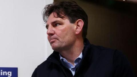 Chris Beech, Interim Manager of AFC Fylde, leaves the home changing room at half-time during the Emirates FA Cup Fourth Round Qualifying match between AFC Fylde and Leek Town at Mill Farm on October 14, 2023 in Fylde, United Kingdom.